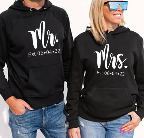 Woman and man wearing black hoodies, mockup for hoody sweatshirt design