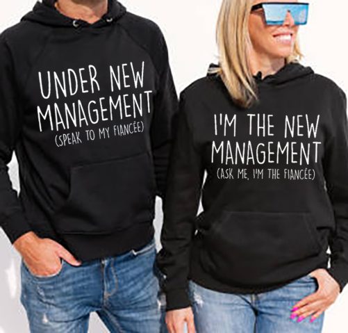 Woman and man wearing black hoodies, mockup for hoody sweatshirt design